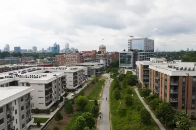 Aerial view of Atlanta BeltLine greenway with multistory buildings one ither side
