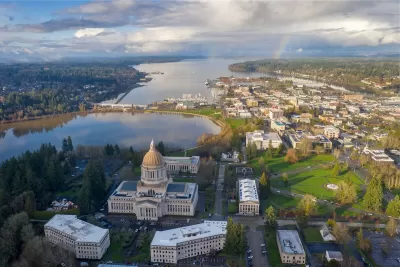 Aerial view of Olympia, Washington with state cpaitol dome in foreground on a somewhat cloudy day.