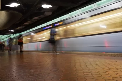 Blurred train in motion passing through underground station in Washington, D.C.