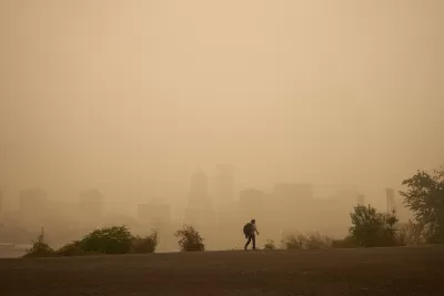 Hazy sky with Portland, Oregon skyline barely visible in background. Man walking in foreground.