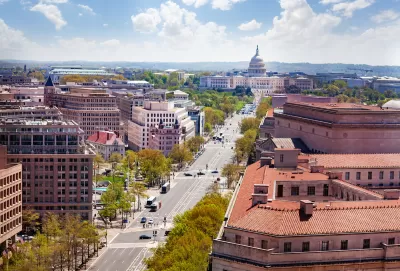 View down Pennsylvania Avenue from above with Capitol dome in background.