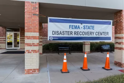 "FEMA - STATE disaster recovery center" banner on brick building.