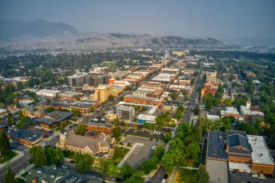 Bird's eye view of downtown Bozeman, Montana, with mountains on the horizon