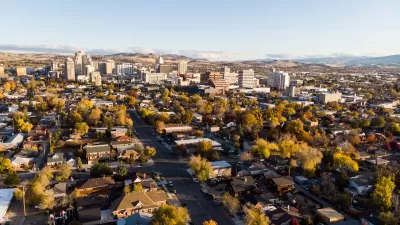 Aerial view of Reno, Nevada with homes in foreground and downtown buildings in background during autumn.