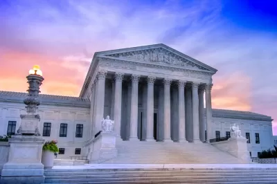 U.S. Supreme Court building in Washington, D.C. against purplish sunset light.