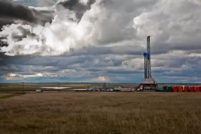 Oil drilling rig on plain in the Midwest.