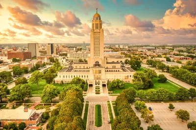 Aerial view of Nebraska state capitol and downtown Lincoln, Nebraska in golden light.