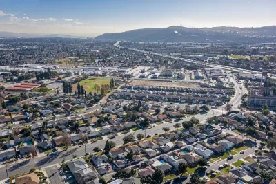 Aerial view of low-rise neighborhood near ocean in South Bay, Los Angeles, California.
