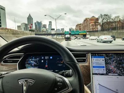 Tesla self-driving car view from inside dashboard.