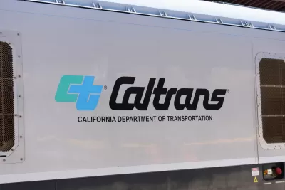 Close-up of Caltrans logo on white passenger train
