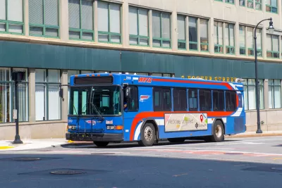 Blue bus on city street