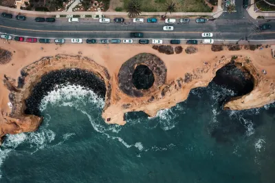 Bird's eye view of coastal erosion next to a roadway in Sunset Cliffs, California.