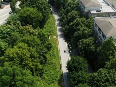 Aerial view of Atlanta BeltLine paved bike trail surrounded by green trees