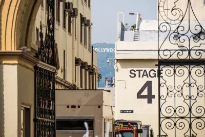 "Stage 4" soundstage wall seen through ornate metal gate at Paramount Studios lot in Los Angeles, California.