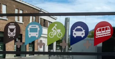 Sign with icons indicating access to multiple transportation modes in Le Havre, France