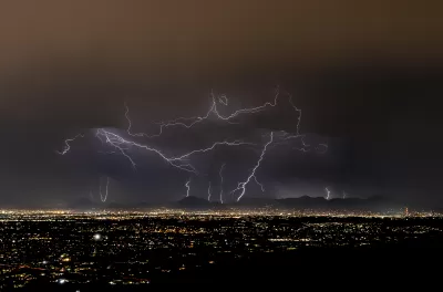 Lightning strikes over Tucson, Arizona at night during monsoon storm