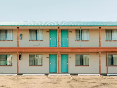 Roadside motel with turquoise room doors in Tucumcari, New Mexico.