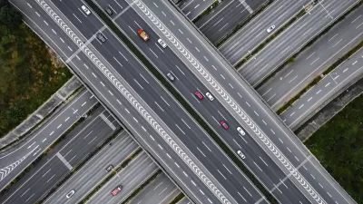 Overhead view of multilane elevated highway with multiple levels.