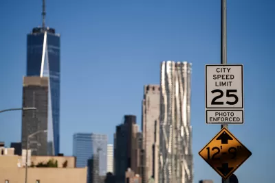 Black and white "City speed limit 25 mph" sign in New York City with One World Trade Center building in distant background.