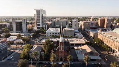 Aerial view of downtown Stockton, California with brick church in foreground.