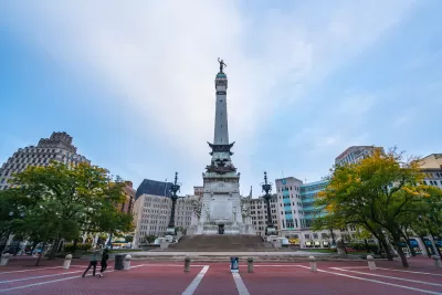 Soldiers and Sailors Monument in traffic circle in Indianapolis at twilight.