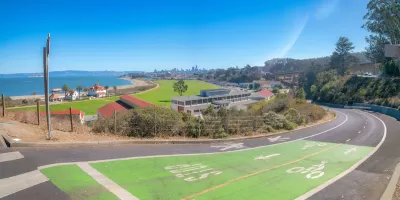 Green painted bike and pedestrian trail with view of San Francisco Bay.