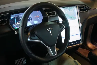 Interior of Tesla car with dashboard.