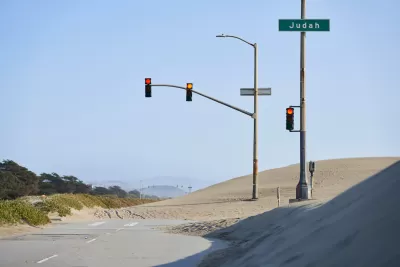Great Highway roadway on San Francisco coast blocked by sand.