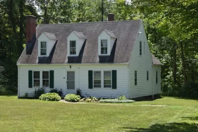Craftsman-style white kit home from Sears catalog sold in early 20th century