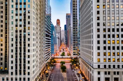 View of down La Salle Street lined with skyscrapers in downtown Chicago.