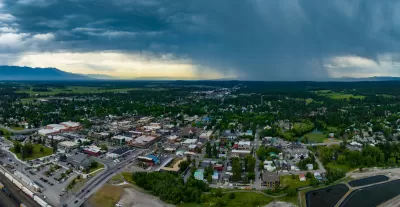 Aerial view of Whitefish, Montana with storm clouds in background