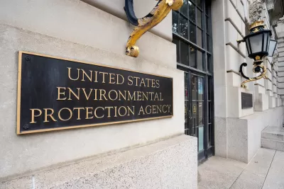 Close-up of bronze plaque on building with "United States Environmental Protection Agency" text.