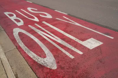 Close-up of red painted Bus Only lane.