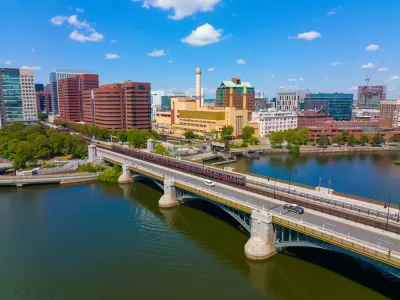 Cambridge Kendall Square skyline and MBTA red line train on Longfellow Bridge aerial view, Boston, Massachusetts MA, USA.