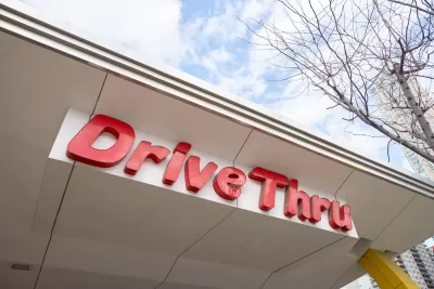 Close-up of red DriveThru sign at McDonald's fast food restaurant in Chicago, Illinois.
