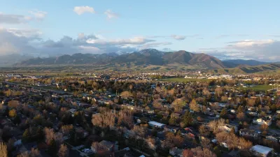 Aerial view of Bozeman, Montana with mountains in background.