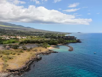 Aerial view of coastal Hawaii with houses.