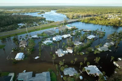 Aerial view of flooded small homes in Florida after hurricane.