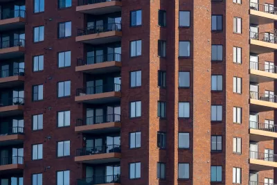 Close-up of facade of red brick high-rise apartment building in Columbus, Ohio.