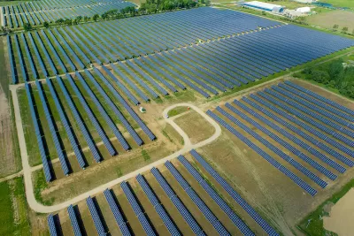 Aerial view of large solar panel installation in rural area in Indiana.