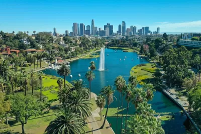 Downtown Los Angeles viewed from Echo Park with lake with artesian fountain in foreground.
