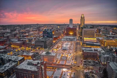 Aerial view of downtown Omaha, Nebraska with holiday lights at sunset.