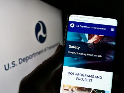 Close-up of smart phone with USDOT website open.