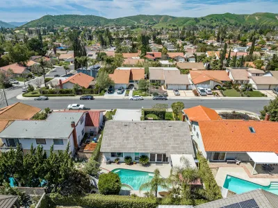 Aerial view of single-family homes with swimming pools in San Diego, California.