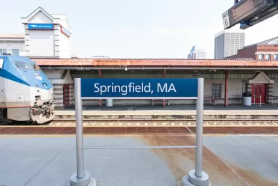 Springfield, MA outdoor Amtrak station platform with train pulling in.