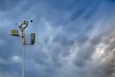 Weather station against stormy sky.