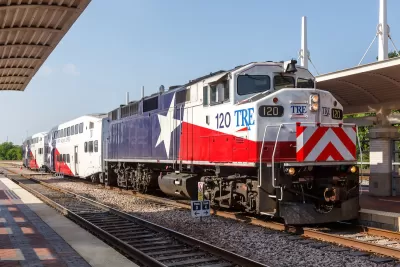 Trinity Railway Express train painted with Texas flag at station in Dallas, Texas.