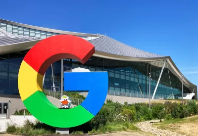Large colorful letter G in front of Google campus building in Mountain View, California.