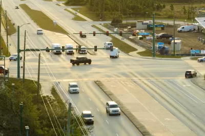 Aerial view of wide multilane road intersection.