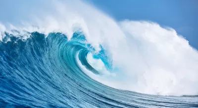Large ocean wave cresting.